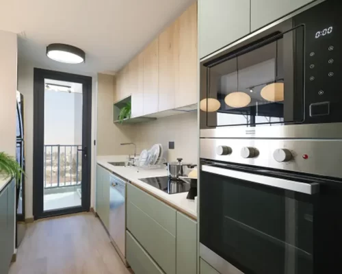 Cocina amoblada logia departamento en Providencia venta con bono pie